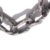 Close-up of the textured thick chain links of an Aji XL silver chunky chain necklace under bright lighting.