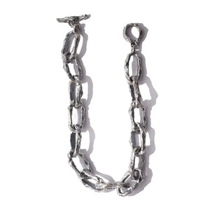 Aji XL silver heavy chain necklace with large textured links laid flat on a white background.