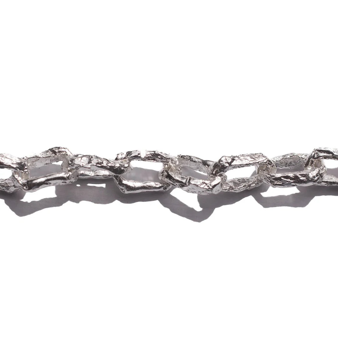 Close-up of the textured interlocking sterling silver links of JewelryLab's Ula Necklace
